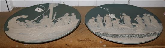 Pair of Mettlach jasperware style large wall chargers, decorated classical scenes (one repaired)